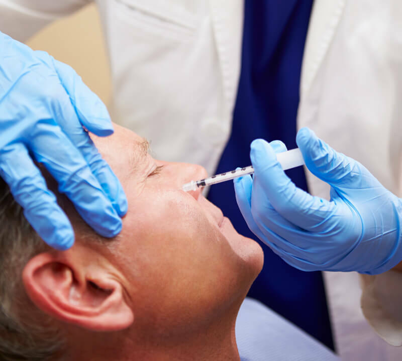 Man receiving BOTOX and Neurotoxins treatment